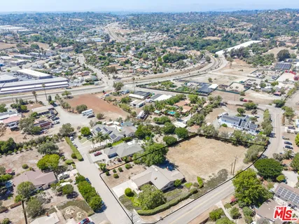 an aerial view of residential house with outdoor space
