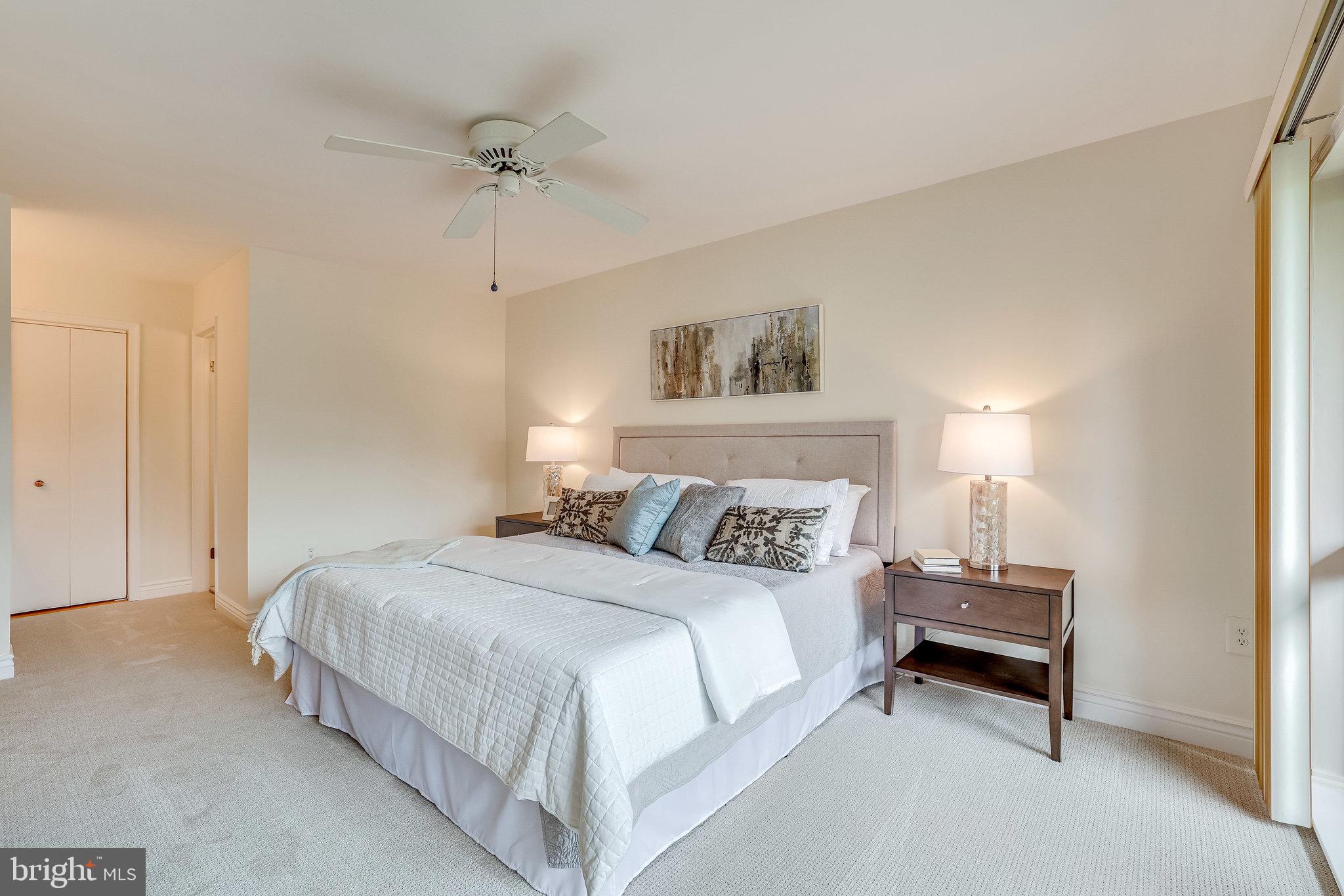 2024 Lakebreeze Way Reston, VA 20191 - Photo 35 of 95 a bedroom with a bed and a chandelier