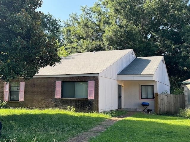 4579 Buffer Drive Memphis, TN 38128 - Photo 13 of 13 a view of a yard in front of a house with plants and large tree