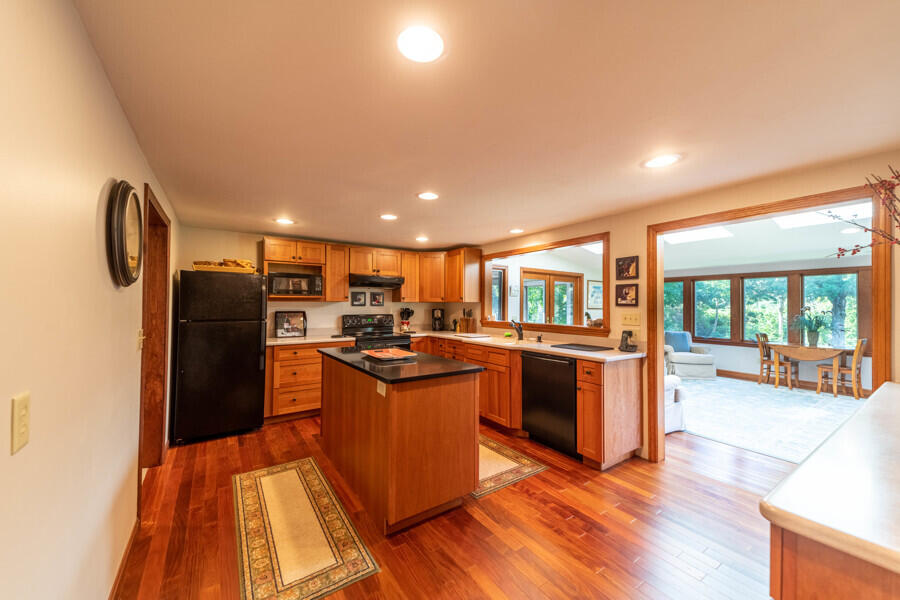 7 Point Hill Road West Barnstable, MA 02668 - Photo 14 of 28 a kitchen with stainless steel appliances granite countertop a refrigerator a stove top oven and sink