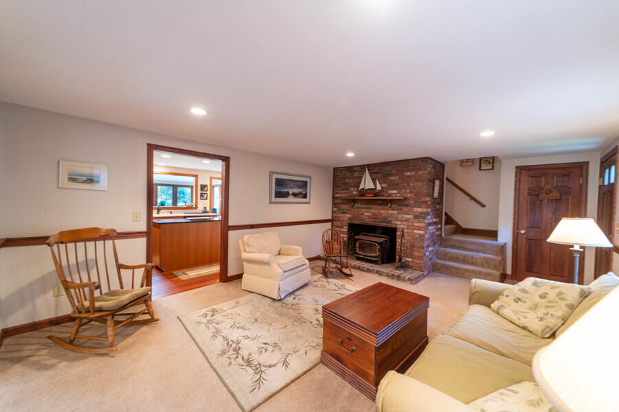 7 Point Hill Road West Barnstable, MA 02668 - Photo 18 of 28 a living room with furniture and a fireplace