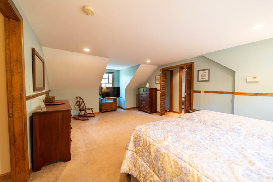 7 Point Hill Road West Barnstable, MA 02668 - Photo 24 of 28 a large bedroom with a bed and dresser