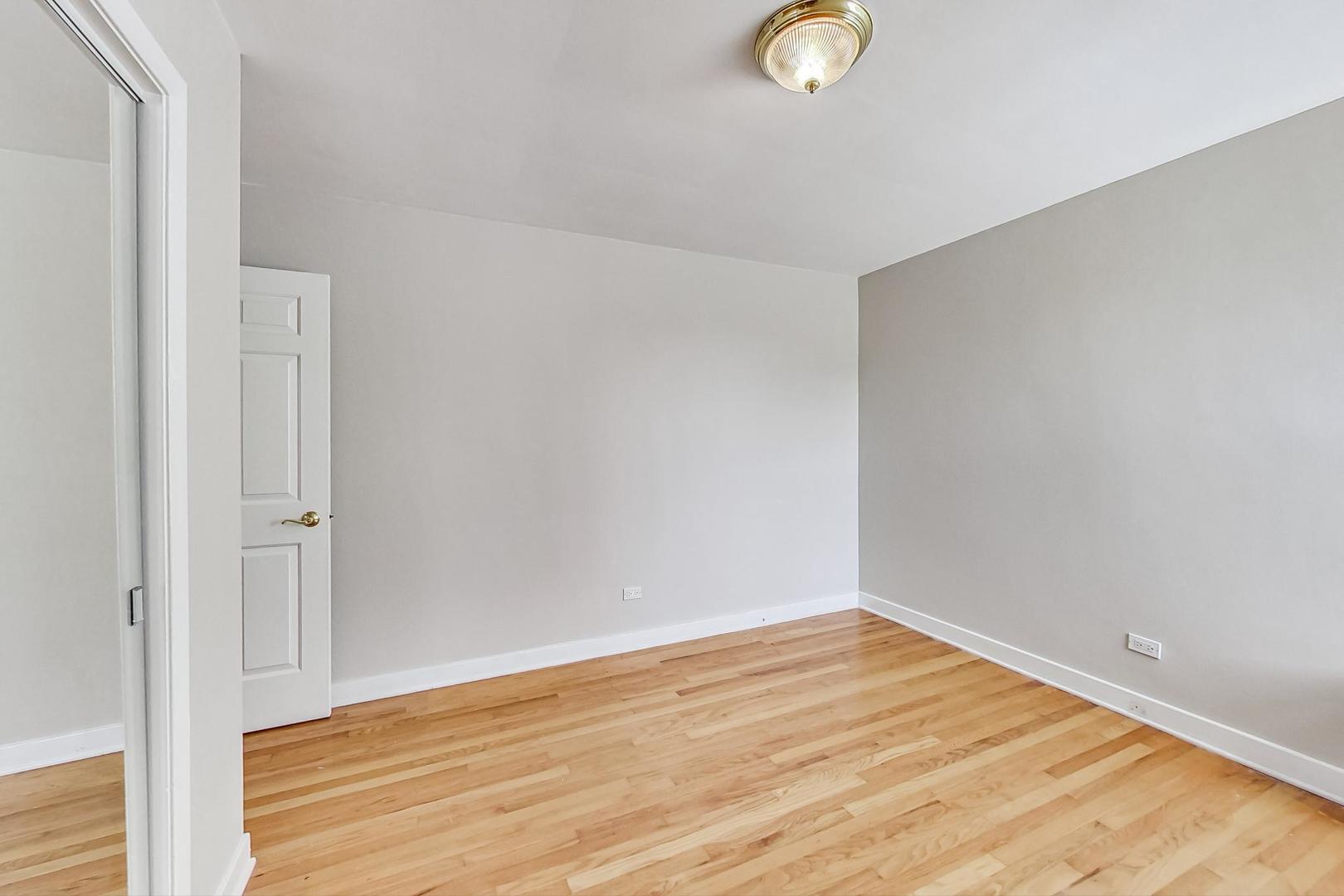 7400 North Sheridan Road, Unit 2 Chicago, IL 60626 - Photo 17 of 23 a view of empty room with wooden floor