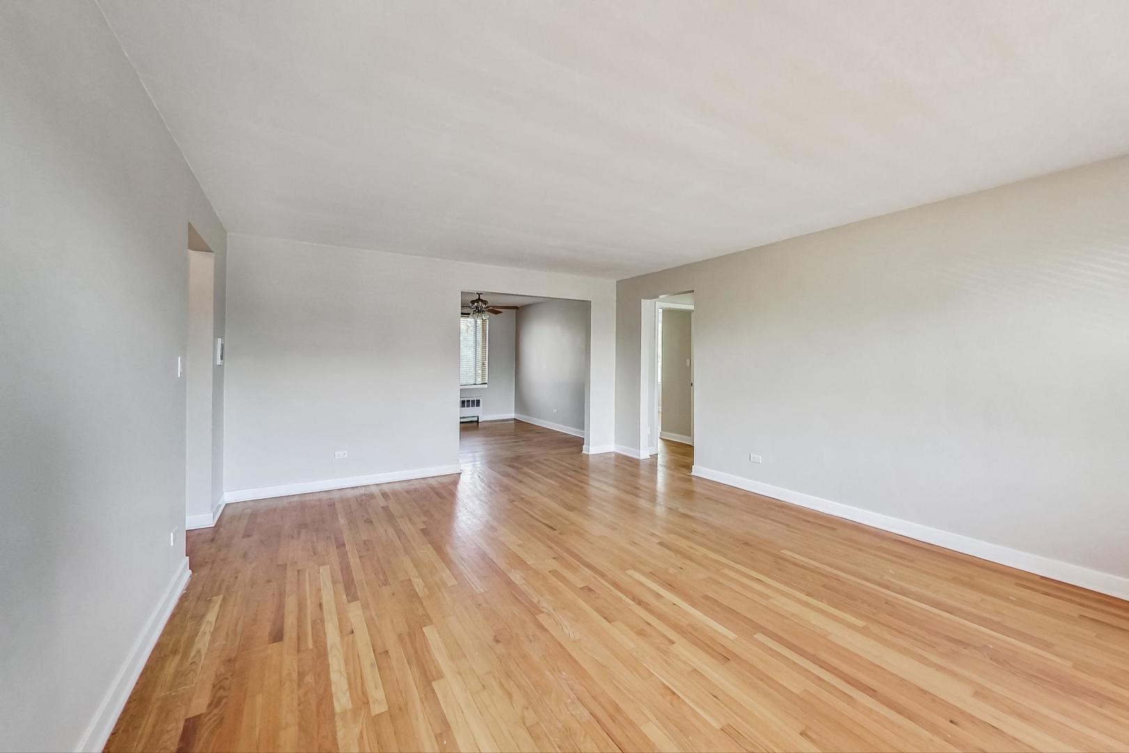 7400 North Sheridan Road, Unit 2 Chicago, IL 60626 - Photo 6 of 23 a view of empty room with wooden floor