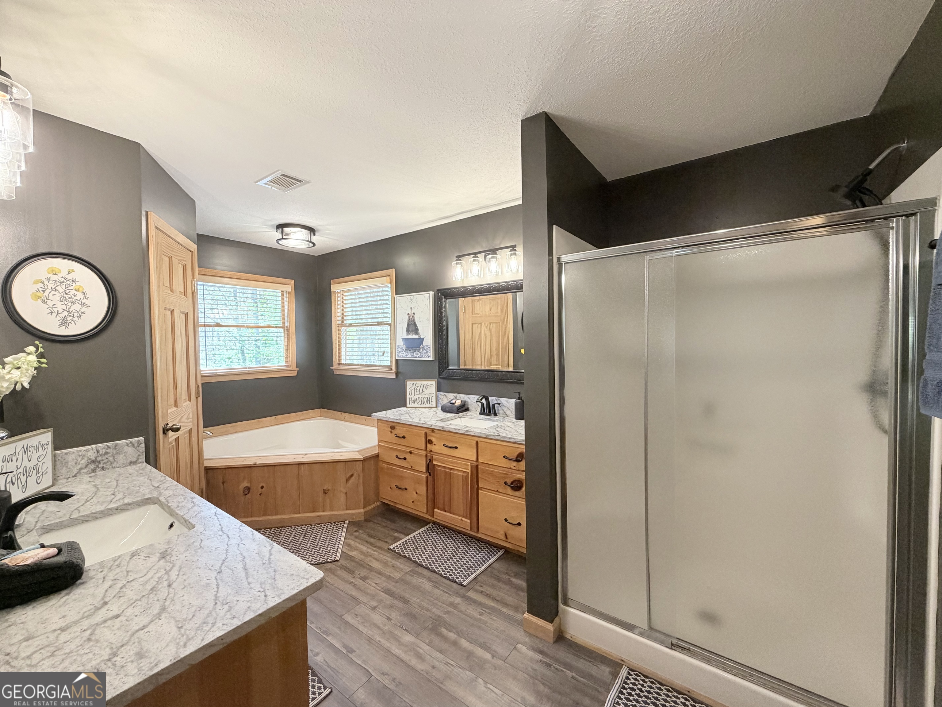 119 Summit Street, Unit 158R Ellijay, GA 30540 - Photo 22 of 64 a large bathroom with a granite countertop tub sink shower and mirror