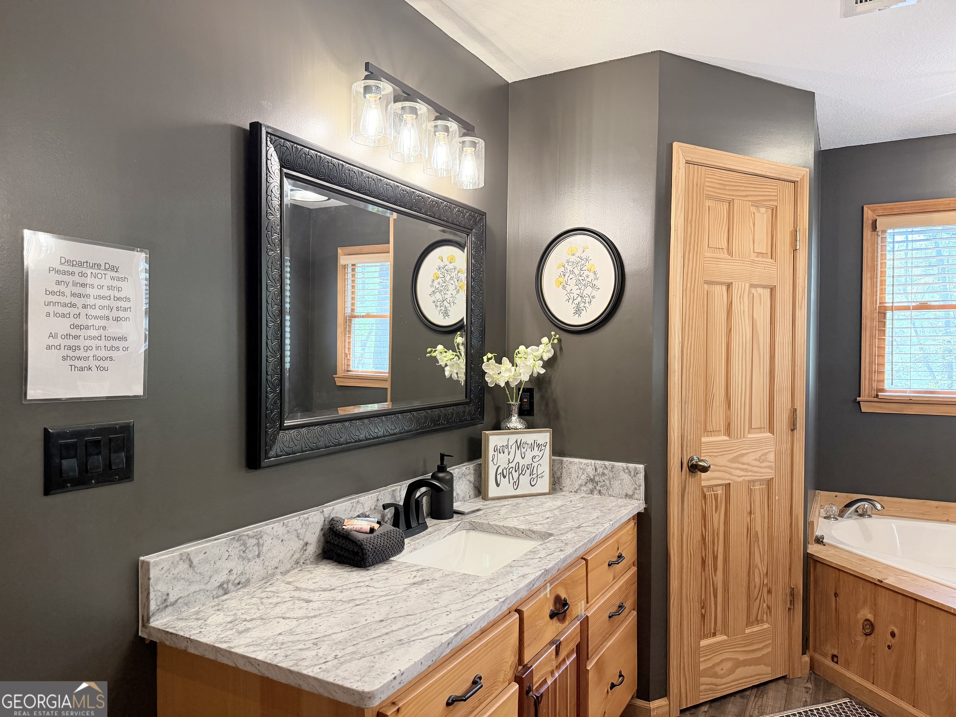 119 Summit Street, Unit 158R Ellijay, GA 30540 - Photo 24 of 64 a bathroom with a granite countertop sink and a mirror