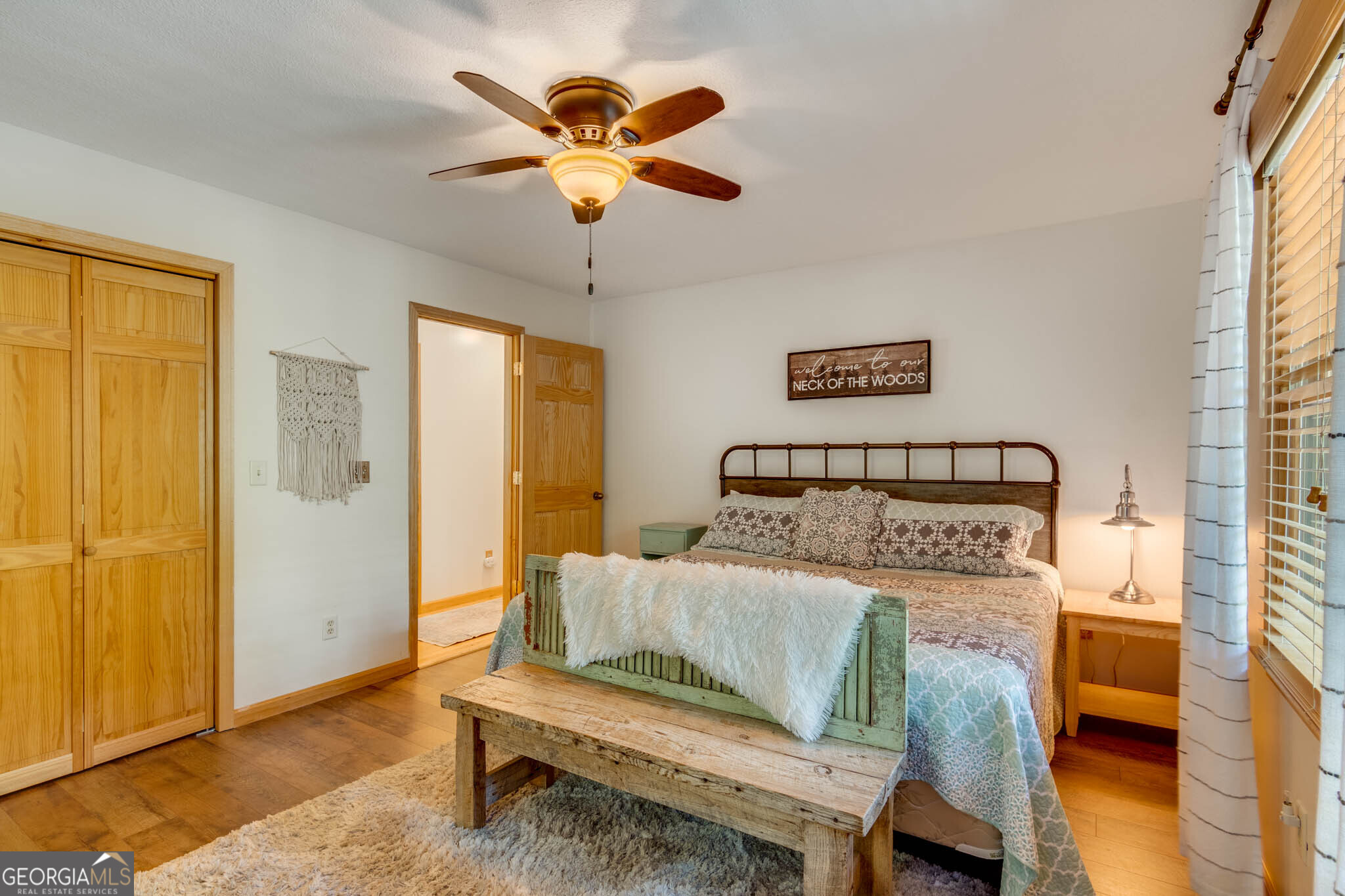 119 Summit Street, Unit 158R Ellijay, GA 30540 - Photo 32 of 64 a bedroom with a bed and a chandelier