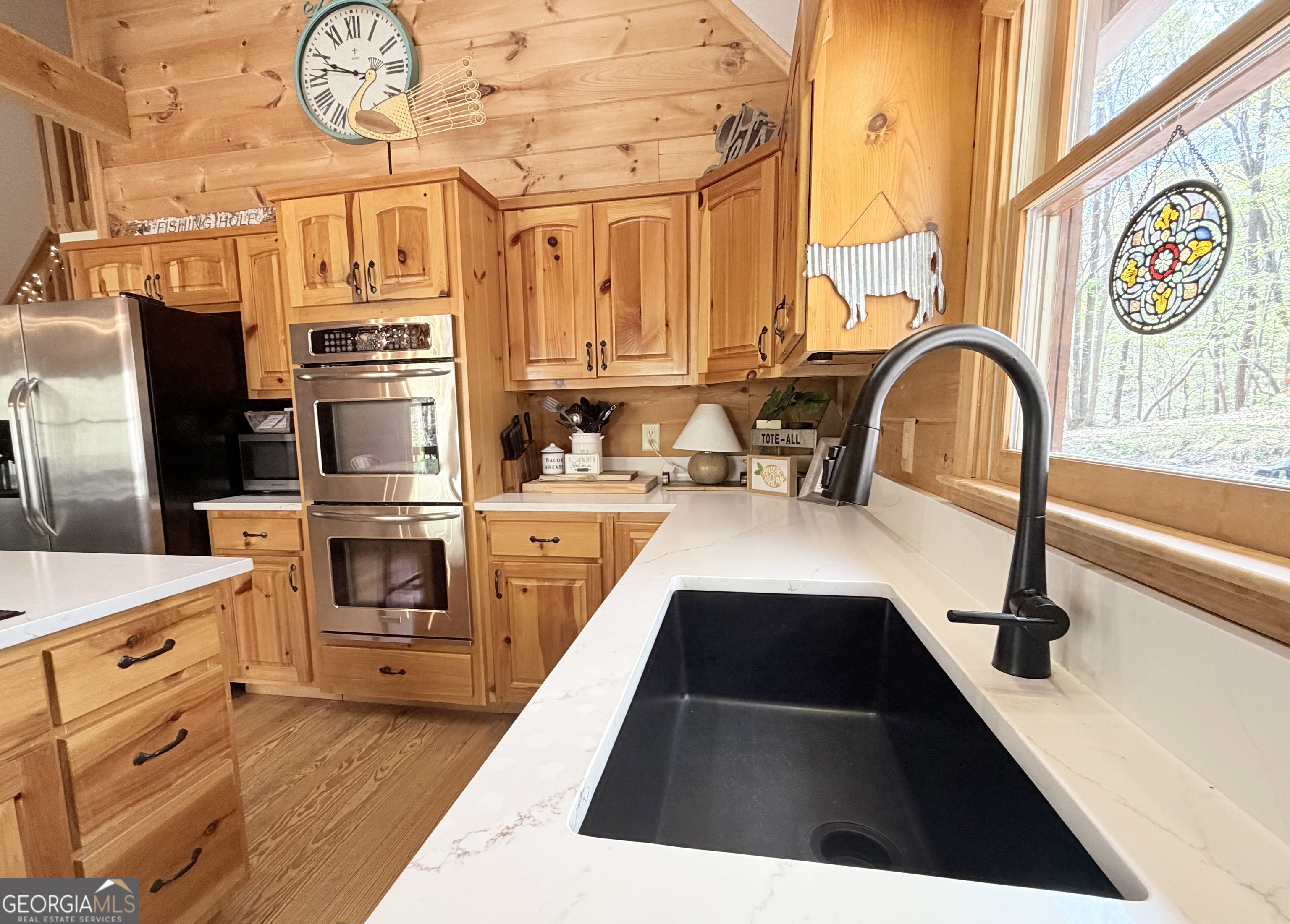 119 Summit Street, Unit 158R Ellijay, GA 30540 - Photo 10 of 64 a kitchen with stainless steel appliances granite countertop a stove and a sink with large cabinets