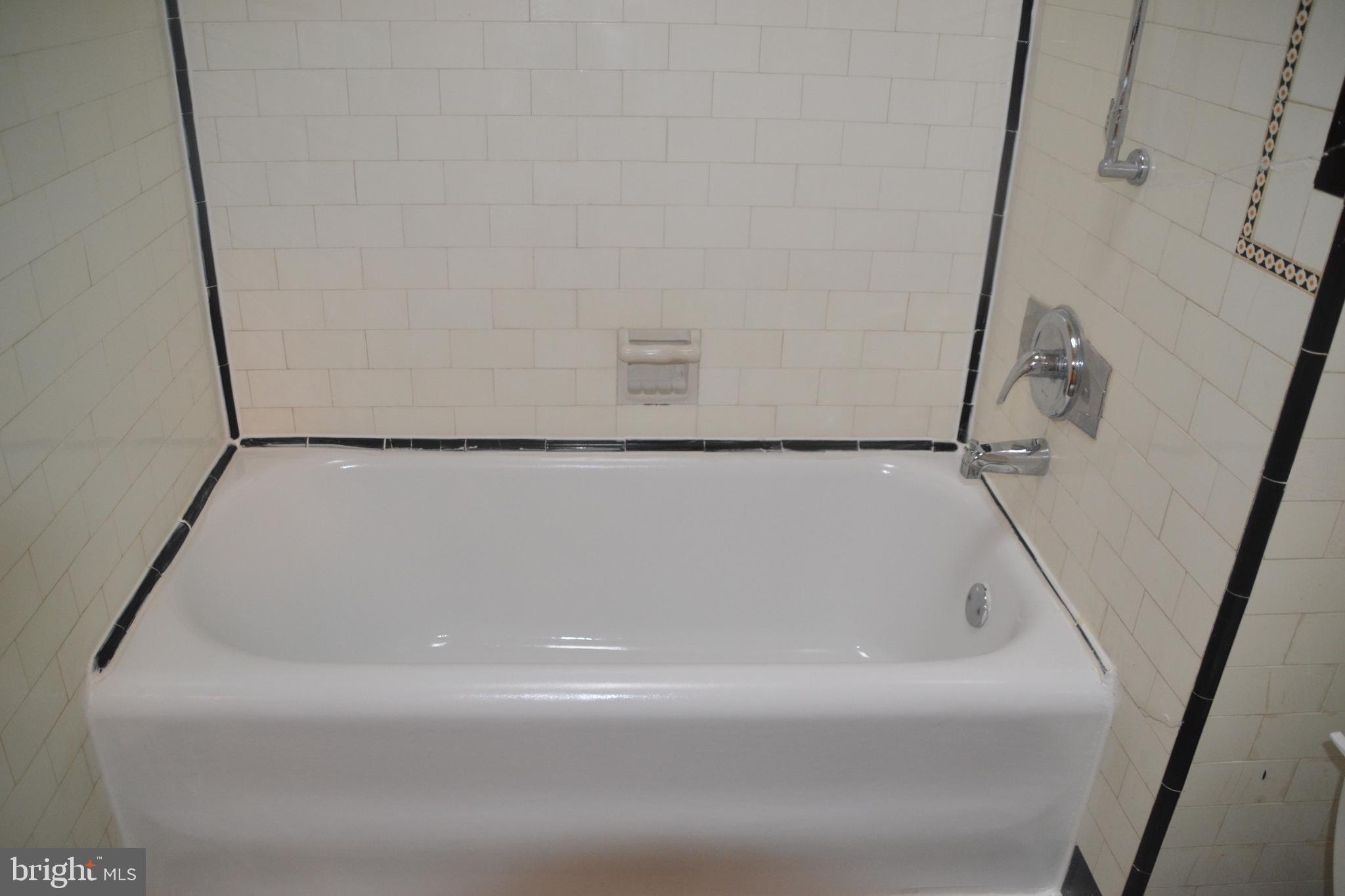 6936 Guilford Road Upper Darby, PA 19082 - Photo 17 of 37 Tub with ceramic tile.