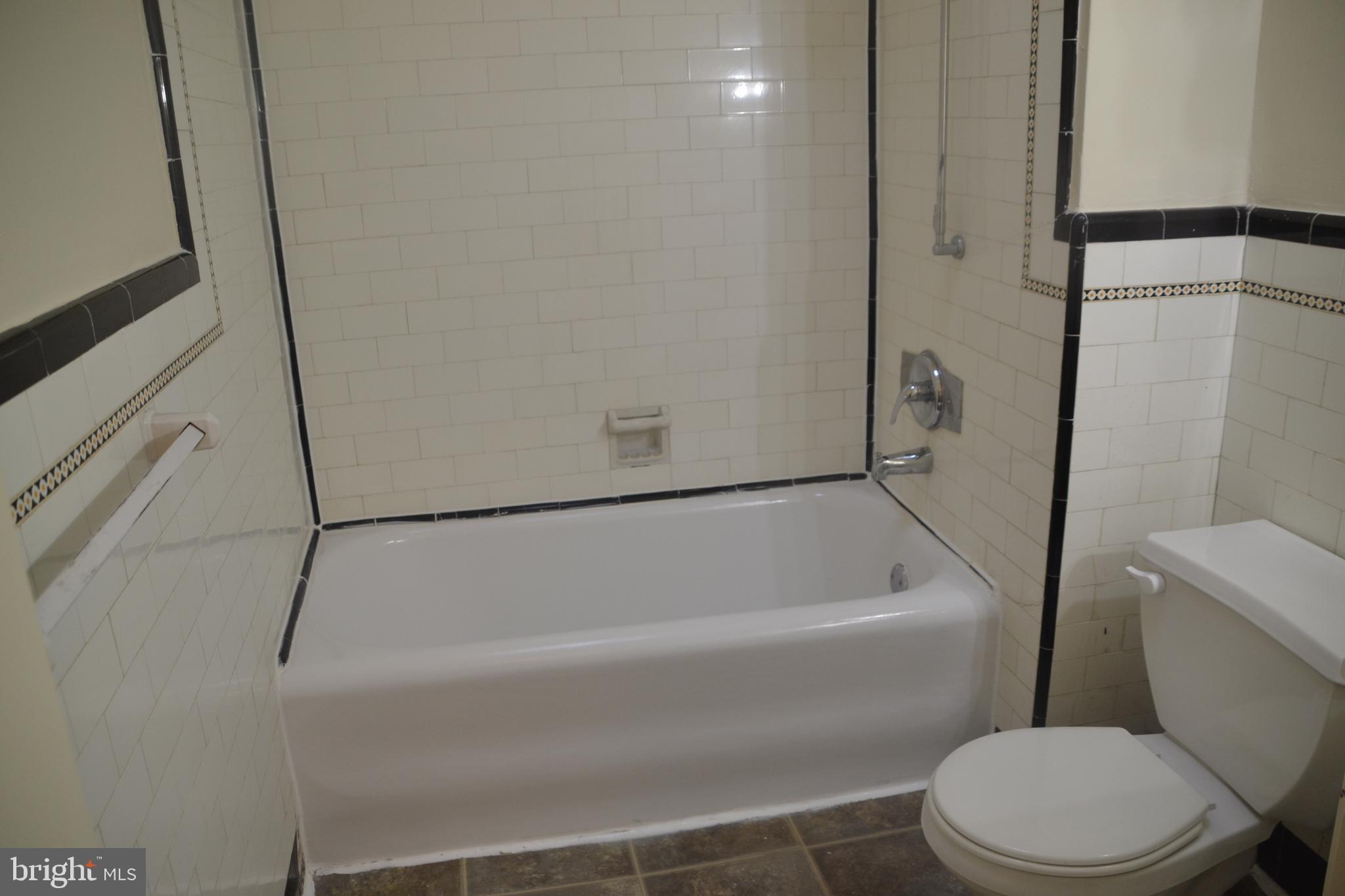 6936 Guilford Road Upper Darby, PA 19082 - Photo 25 of 37 Hall bathroom showing tub and shower.