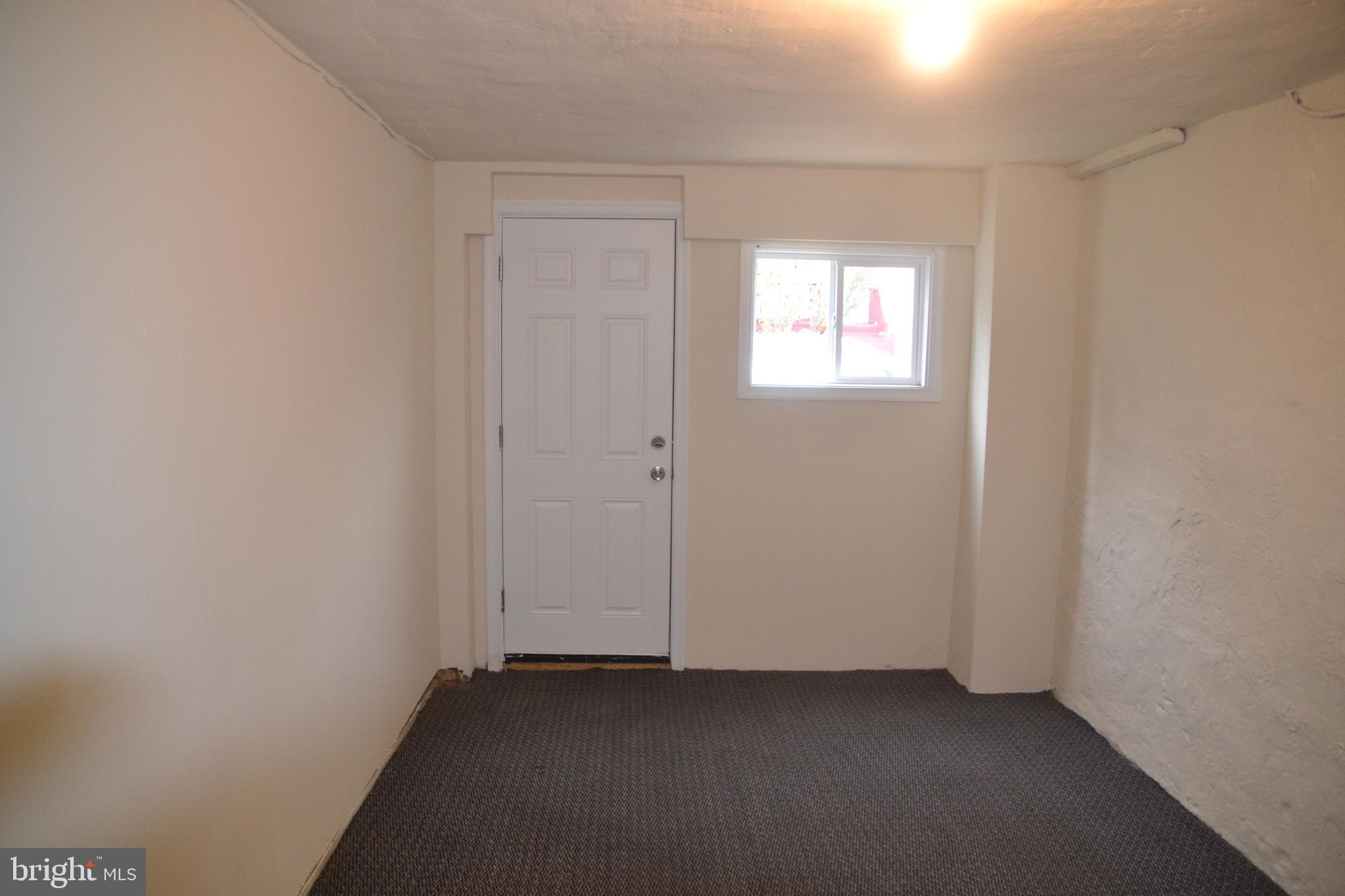 6936 Guilford Road Upper Darby, PA 19082 - Photo 37 of 37 3rd bedroom in the basement with heat and an egres