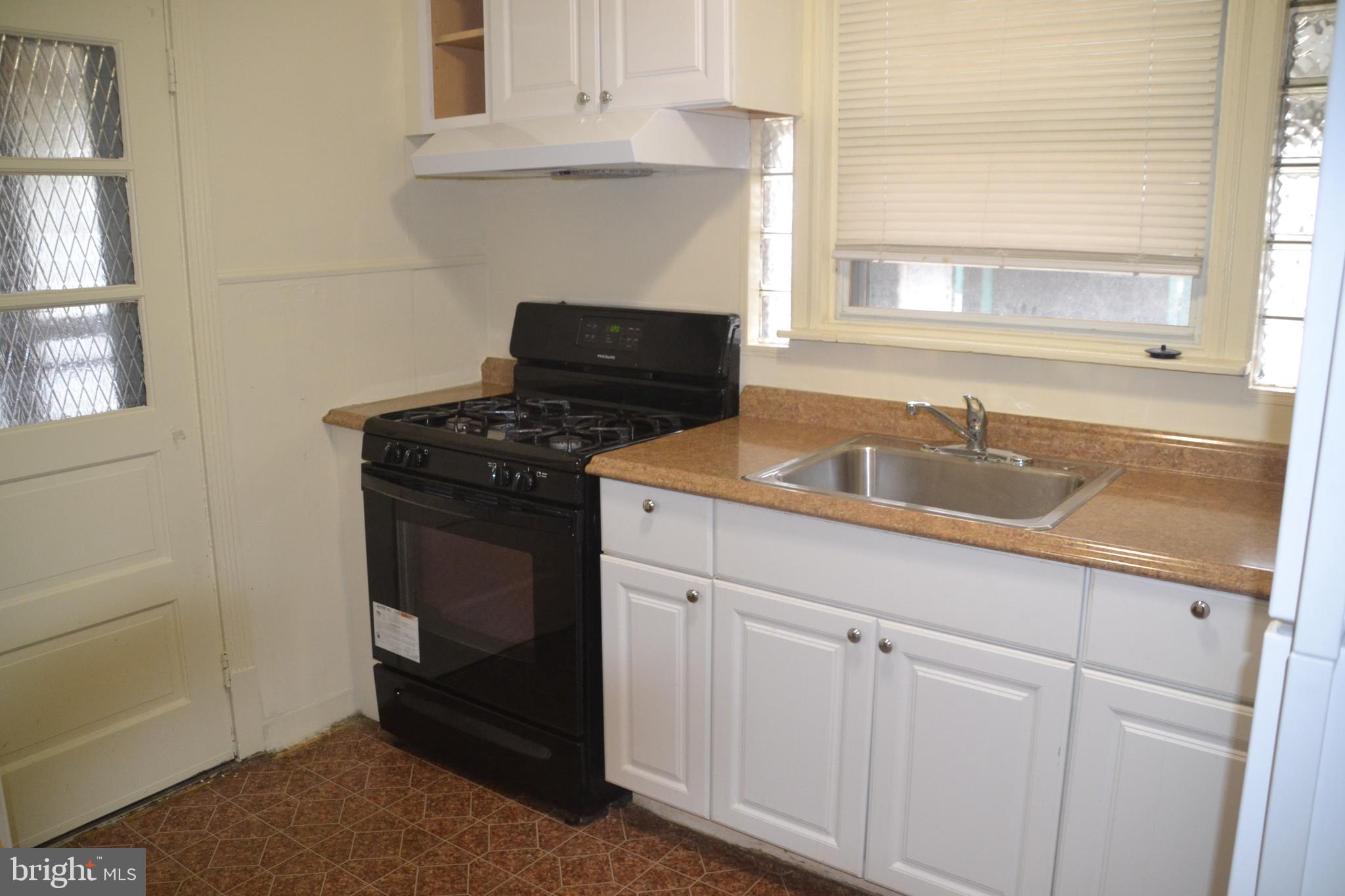 6936 Guilford Road Upper Darby, PA 19082 - Photo 9 of 37 Kitchen with newer cabinest and H/W.