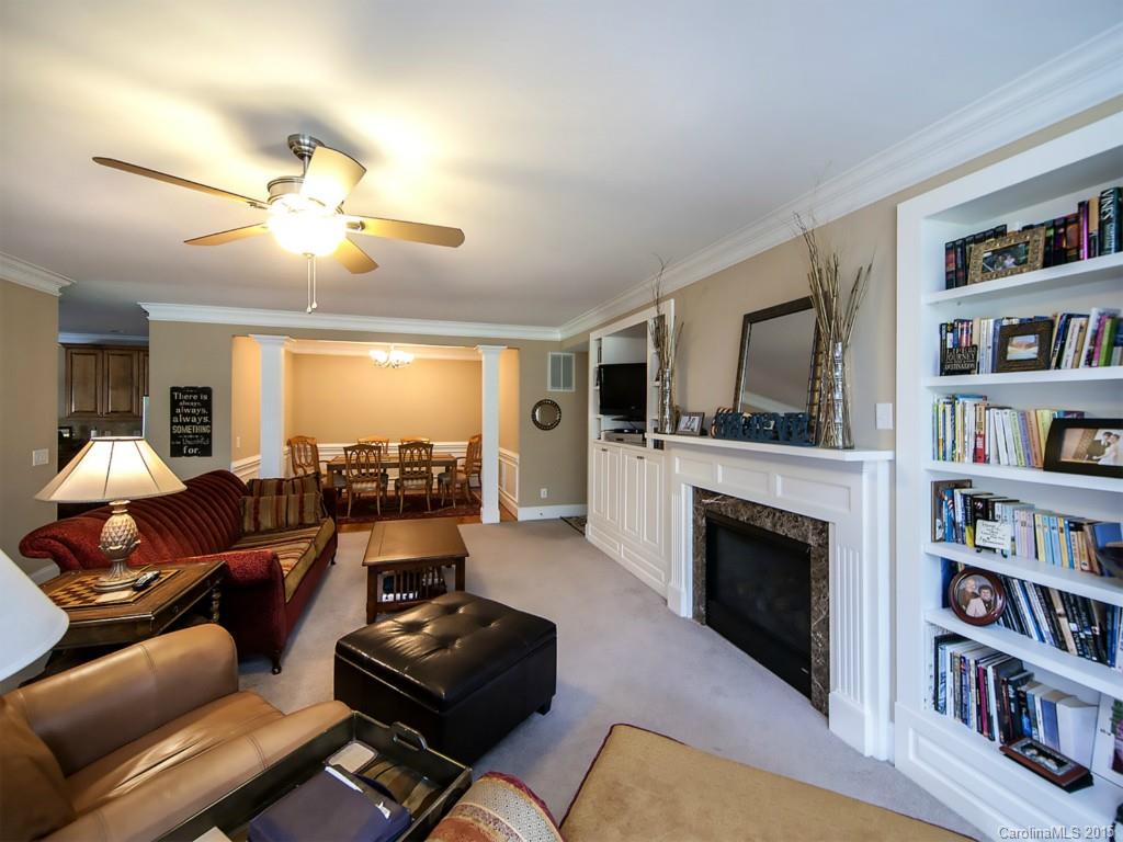 608 Crosswater Lane, Unit 608 Fort Mill, SC 29708 - Photo 2 of 20 a living room with furniture and a fireplace