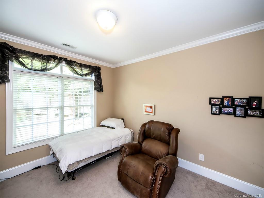 608 Crosswater Lane, Unit 608 Fort Mill, SC 29708 - Photo 11 of 20 a bedroom with a bed and a couch