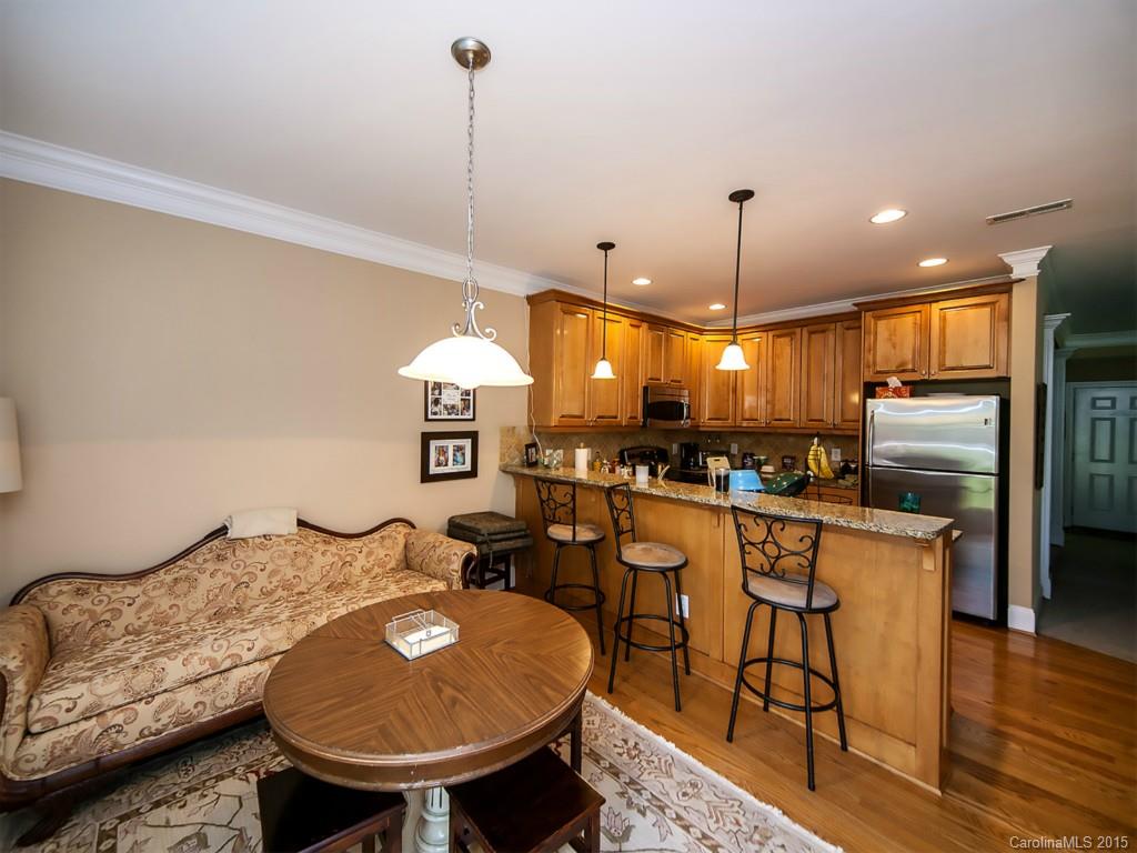 608 Crosswater Lane, Unit 608 Fort Mill, SC 29708 - Photo 16 of 20 a kitchen with stainless steel appliances granite countertop a sink a stove a refrigerator and island