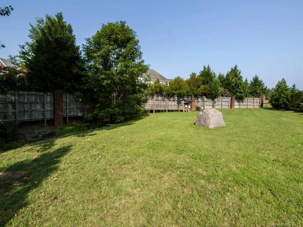 608 Crosswater Lane, Unit 608 Fort Mill, SC 29708 - Photo 19 of 20 a view of a fire pit with a yard