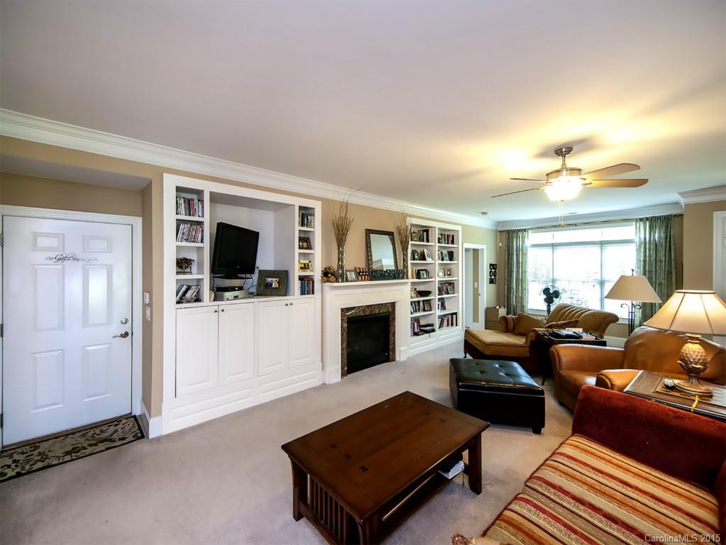 608 Crosswater Lane, Unit 608 Fort Mill, SC 29708 - Photo 3 of 20 a living room with furniture and a fireplace