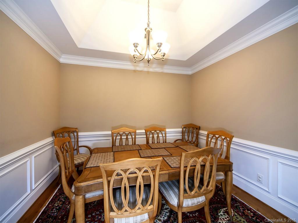 608 Crosswater Lane, Unit 608 Fort Mill, SC 29708 - Photo 4 of 20 a view of a dining room with furniture and chandelier