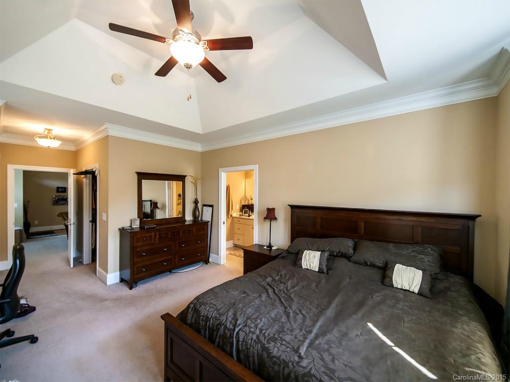 608 Crosswater Lane, Unit 608 Fort Mill, SC 29708 - Photo 7 of 20 a bedroom with a bed and dresser