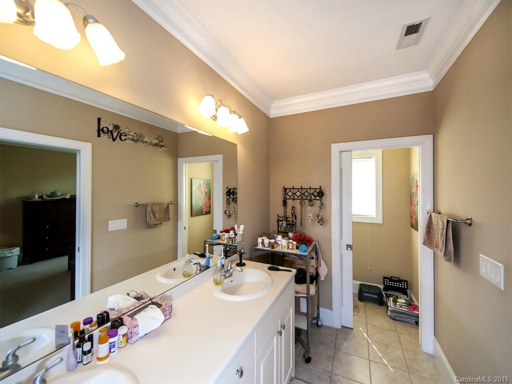 608 Crosswater Lane, Unit 608 Fort Mill, SC 29708 - Photo 8 of 20 a bathroom with a sink double vanity and a mirror