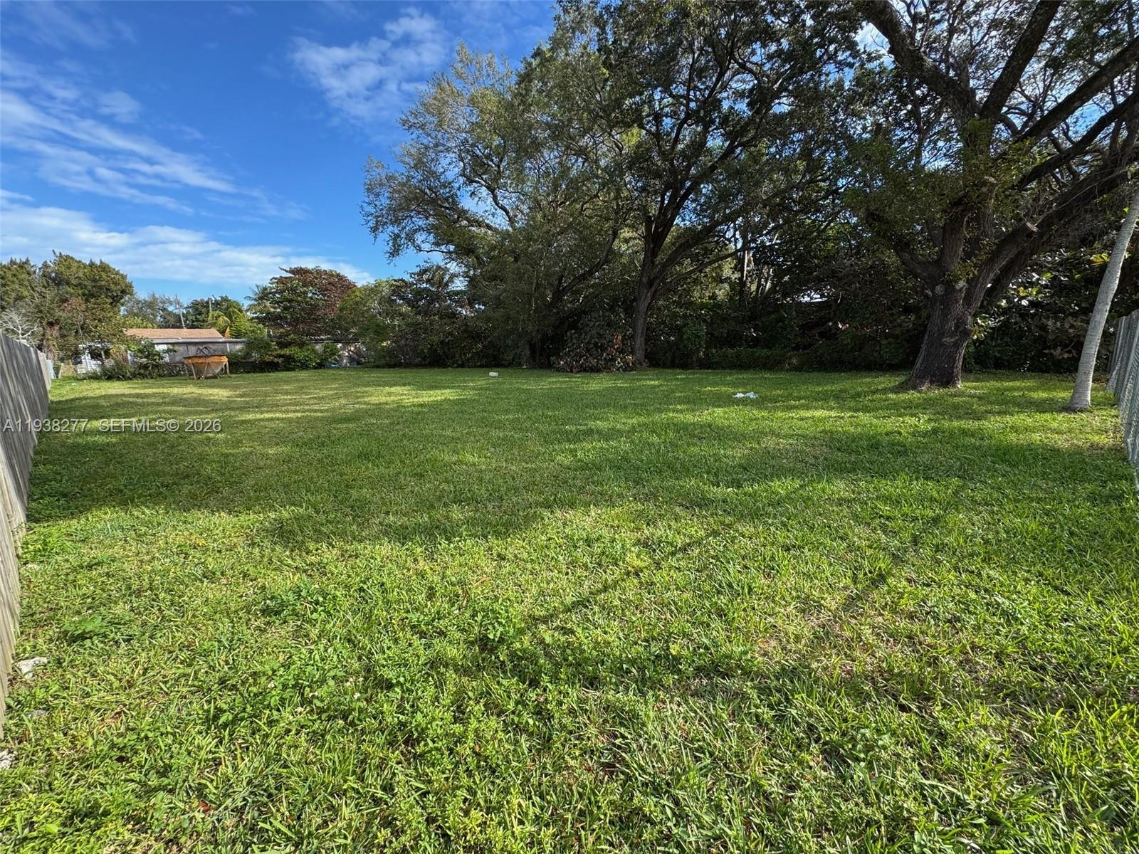 261 Northwest 96th Street Miami, FL 33150 - Photo 2 of 2 a view of outdoor space with deck and yard