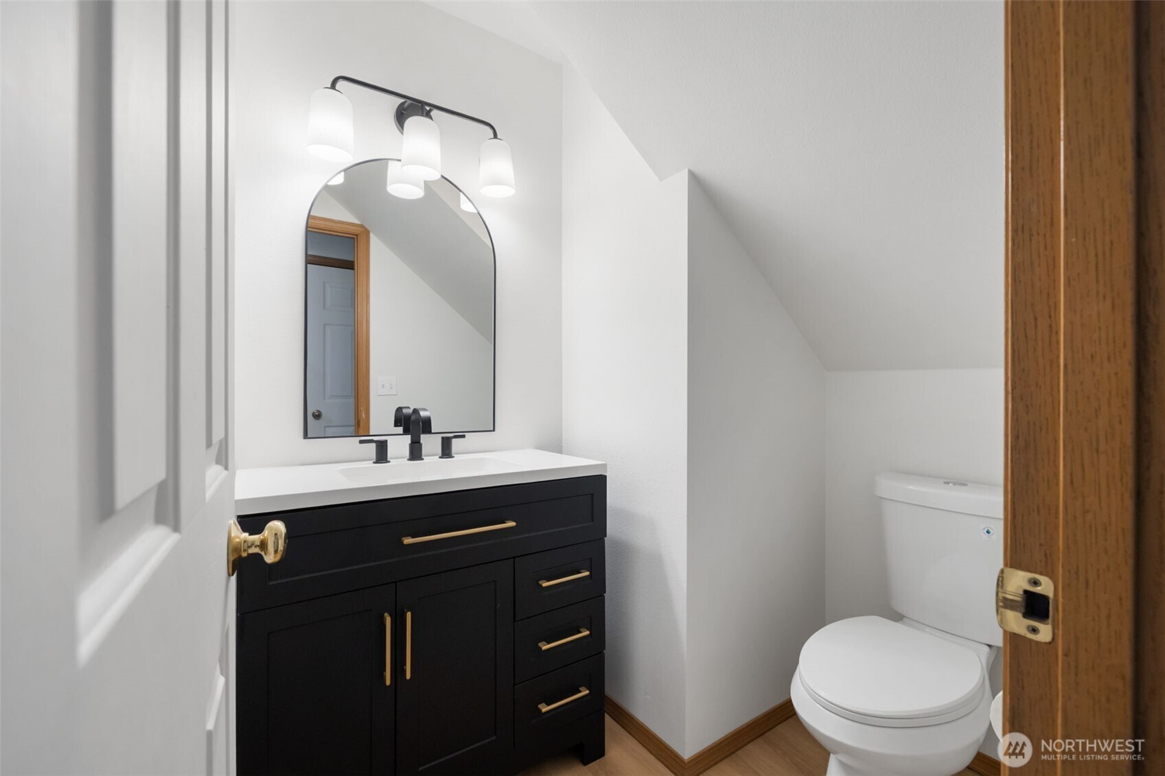 3560 Courtyard Lane Bremerton, WA 98310 - Photo 10 of 26 a bathroom with a sink vanity mirror and toilet