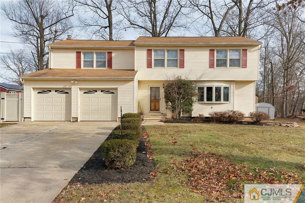 1265 Brookside Road Piscataway, NJ 08854 - Photo 2 of 25 front view of a house with a yard
