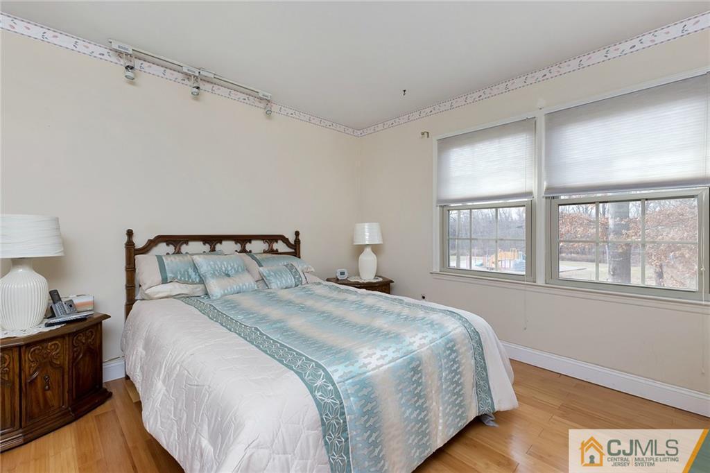 1265 Brookside Road Piscataway, NJ 08854 - Photo 15 of 25 a bedroom with a bed and a window