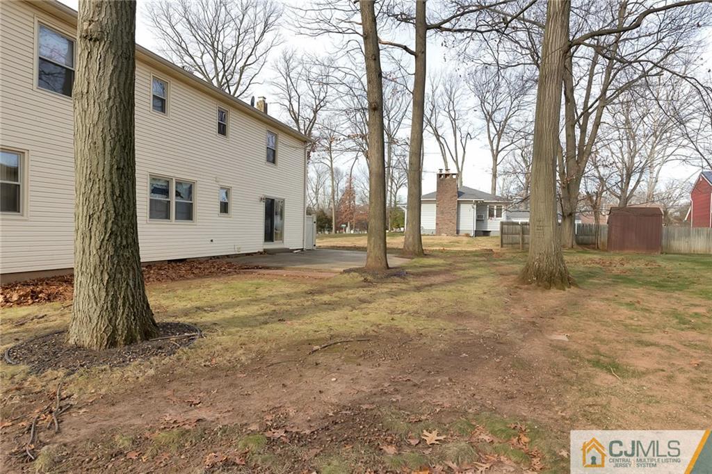 1265 Brookside Road Piscataway, NJ 08854 - Photo 21 of 25 a view of a house with a yard