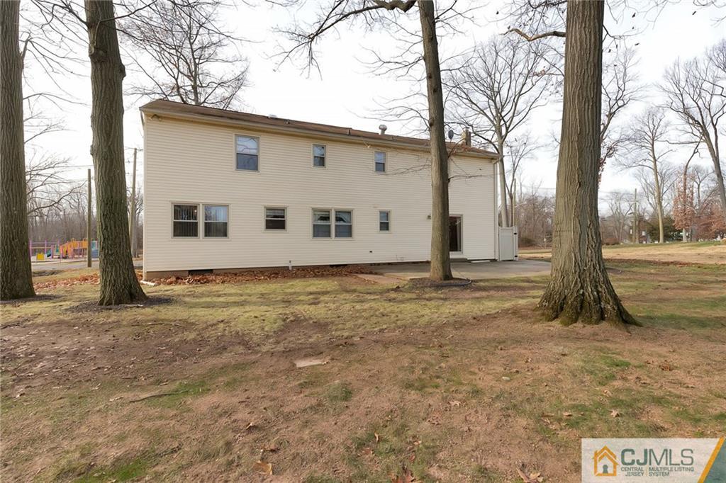 1265 Brookside Road Piscataway, NJ 08854 - Photo 22 of 25 a view of a house with backyard and trees