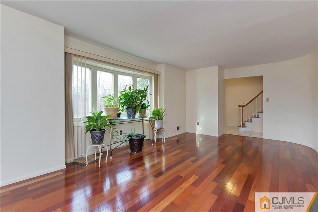 1265 Brookside Road Piscataway, NJ 08854 - Photo 4 of 25 a living room with furniture and a potted plant