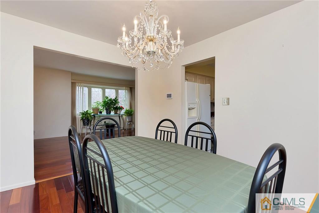 1265 Brookside Road Piscataway, NJ 08854 - Photo 5 of 25 a view of a dining room with furniture and chandelier