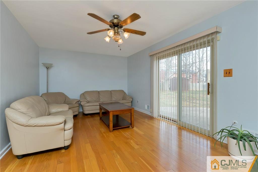 1265 Brookside Road Piscataway, NJ 08854 - Photo 8 of 25 a living room with furniture and a large window