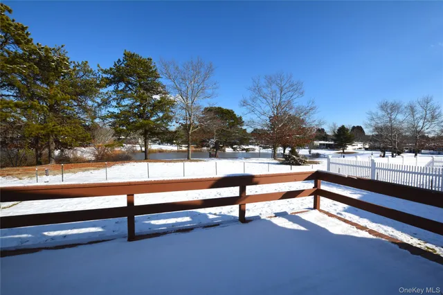 a view of outdoor space with swimming pool and trees in the background