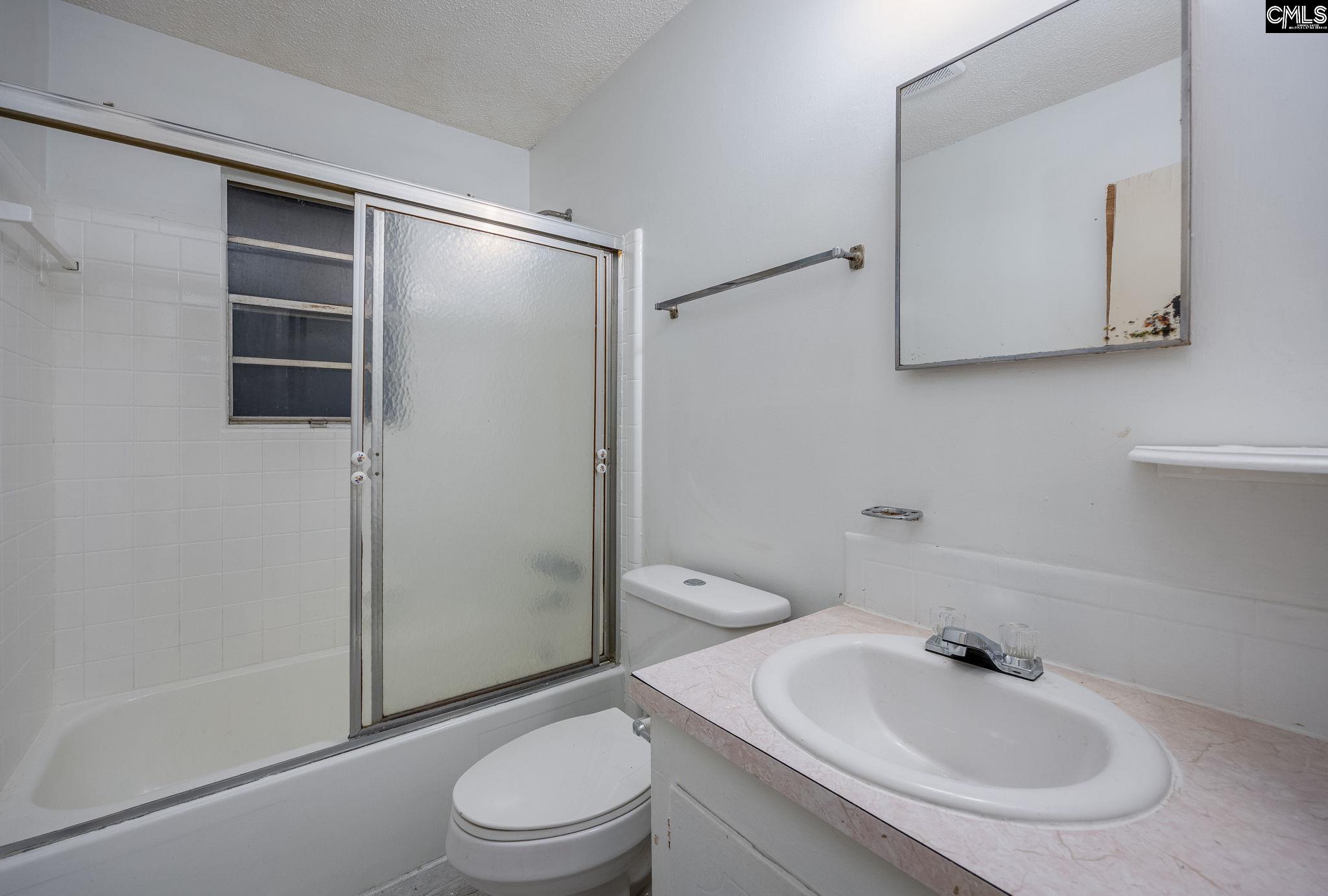 5666 Middleton Court Columbia, SC 29203 - Photo 27 of 42 a bathroom with a sink toilet and shower