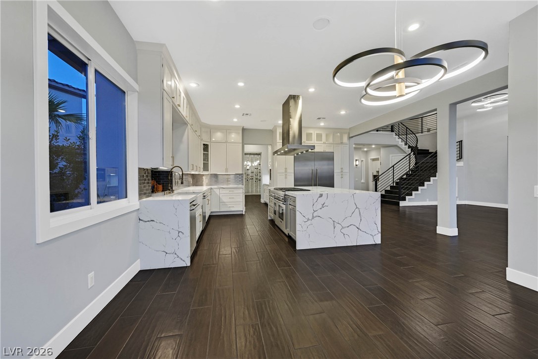 6 Rue Du Ville Henderson, NV 89011 - Photo 37 of 99 This kitchen showcases a contemporary design with sleek finishes and ample space for culinary endeavors.