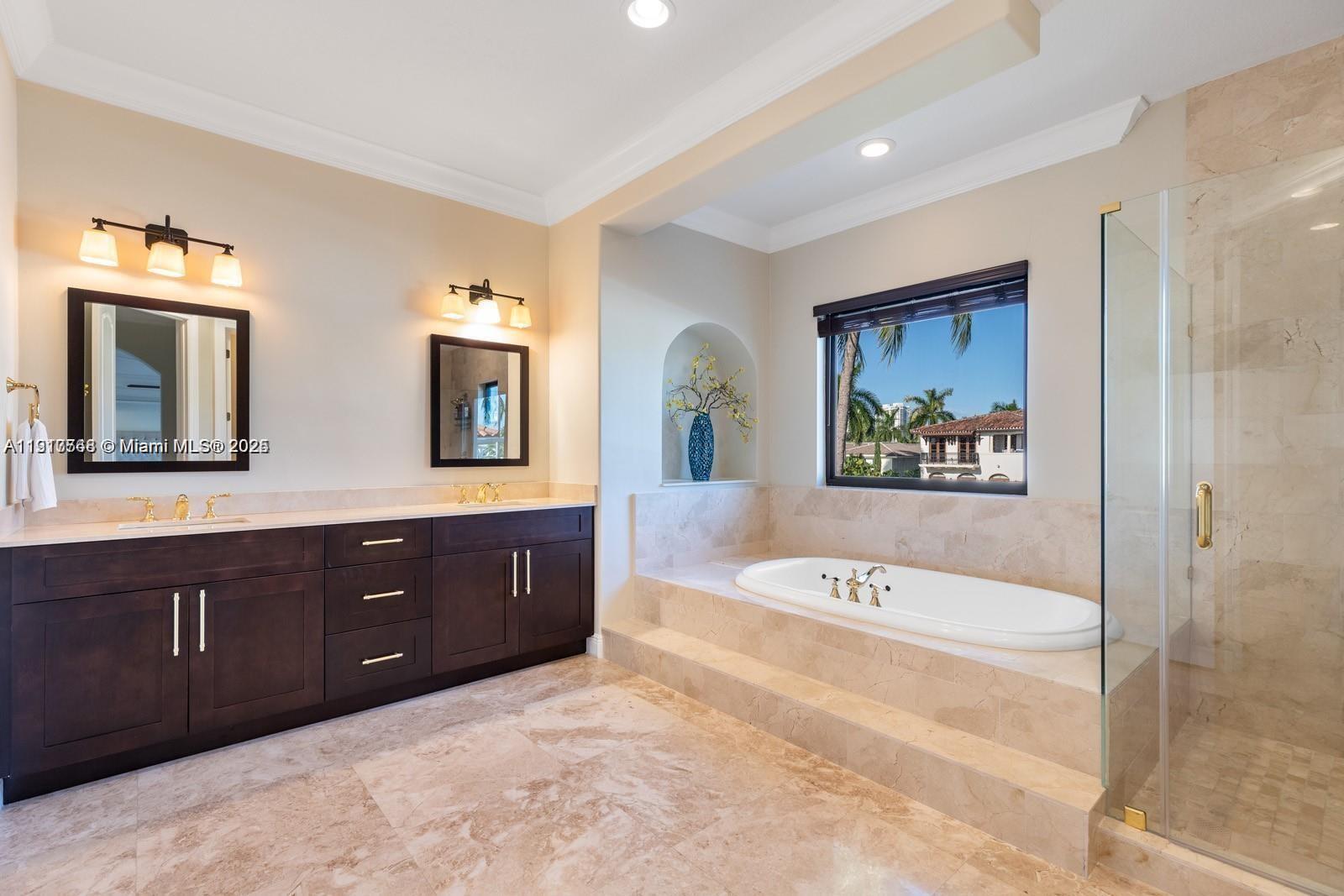 16433 Northeast 31st Avenue North Miami Beach, FL 33160 - Photo 8 of 8 a spacious bathroom with a tub sink and mirror