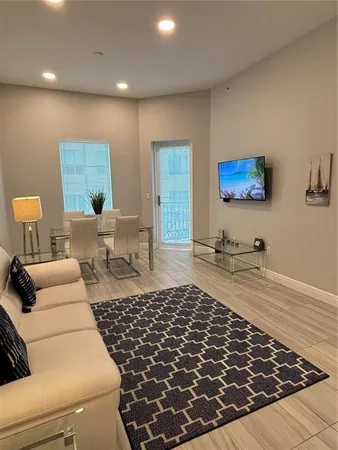 a living room with furniture and a rug