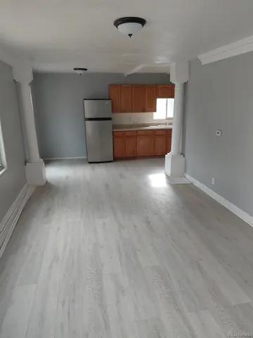a view of empty room with a sink and dishwasher