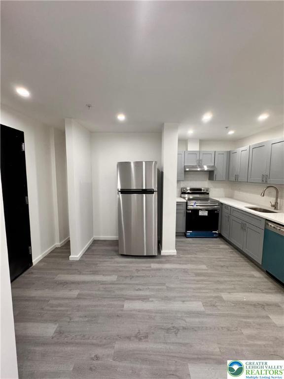 2250 Butler Street, Unit 102 Easton, PA 18042 - Photo 12 of 14 a large kitchen with a refrigerator sink and a stove