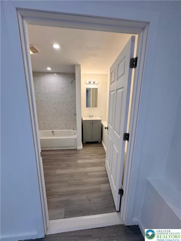 2250 Butler Street, Unit 102 Easton, PA 18042 - Photo 5 of 14 a view of a hallway with wooden floor and staircase