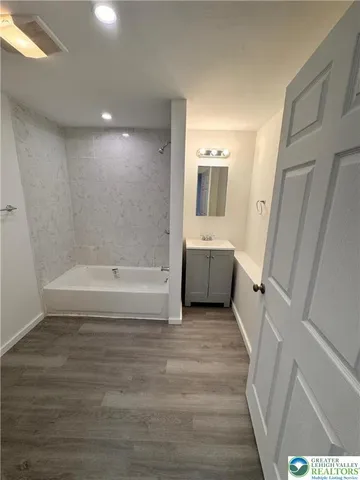 a view of a bathtub in a room