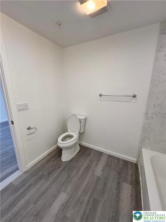 2250 Butler Street, Unit 102 Easton, PA 18042 - Photo 8 of 14 a white toilet sitting next to a white sink
