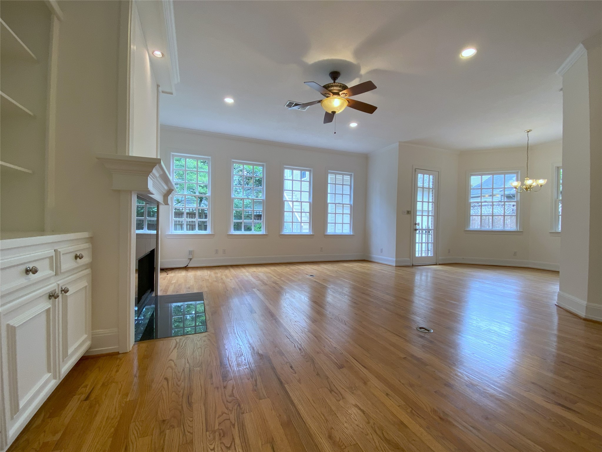 3024 Rice Boulevard Houston, TX 77005 - Photo 11 of 38 Natural light flows into the family room from a wall of windows.