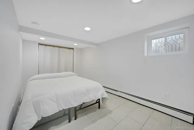 a bathroom with a shower a toilet and sink