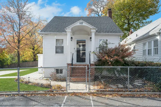 a front view of a house with garage