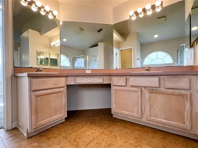 a kitchen with a sink and cabinets