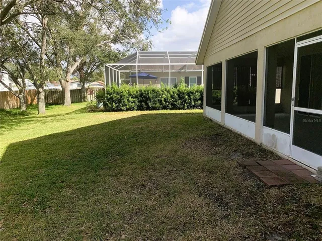 a swimming pool with wooden fence