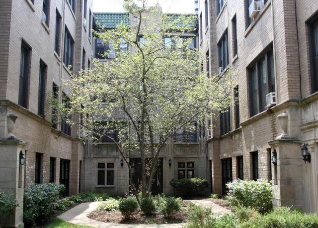 a view of a building with a tree