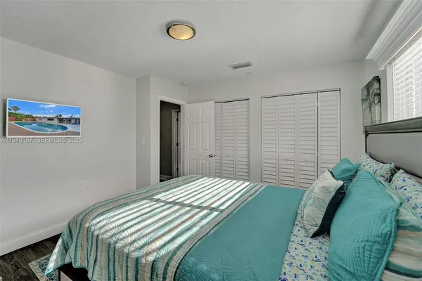 a kitchen with a refrigerator and a sink